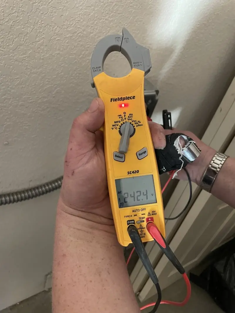 Voltage testing with clamp meter during Whole House Surge Protector in Medina